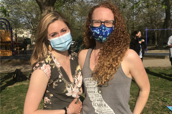 Two members of the herbert lab at the park team outing wearing masks.