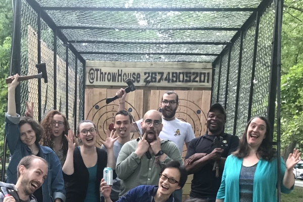 Members of the herbert lab at the throw house lab outing event making silly faces.