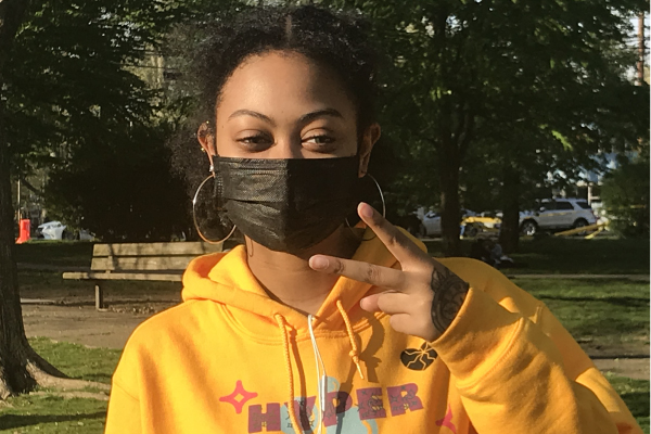 A member of the herbert lab at the park team outing showing the peace sign.